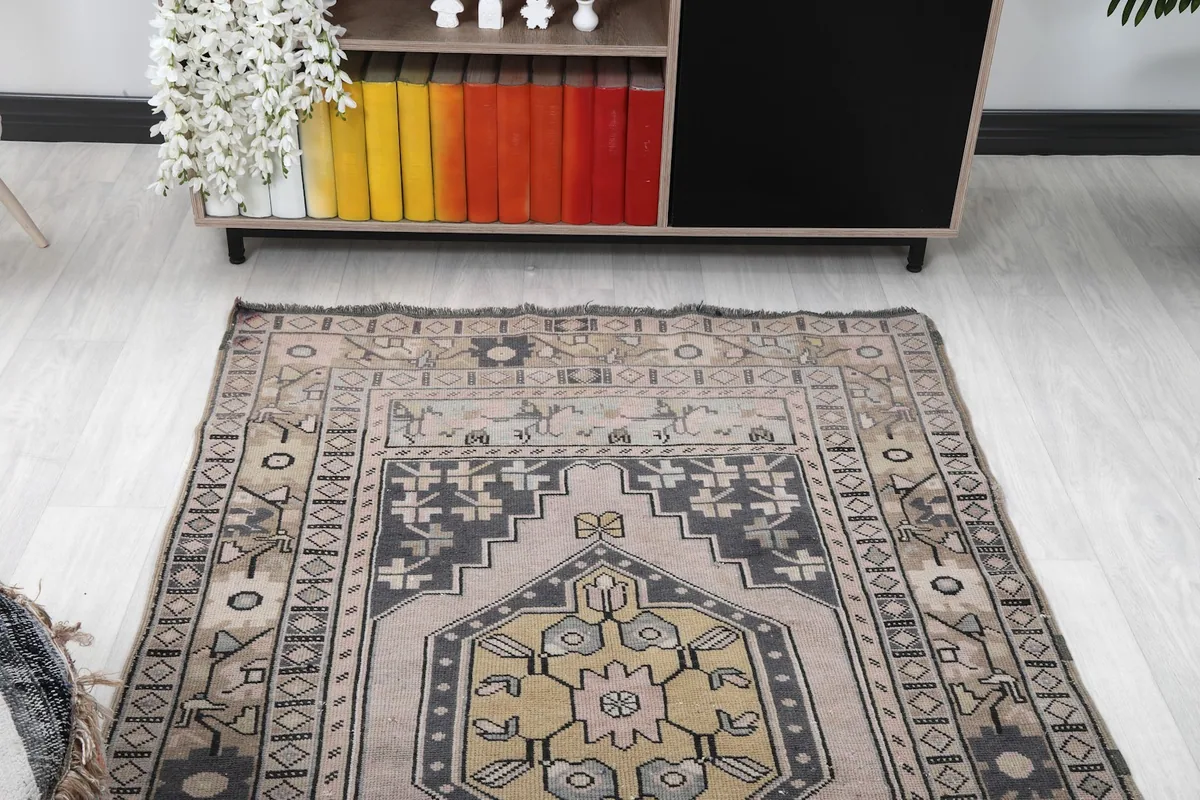 Overhead view of the rug in a room, showing its placement in front of a console