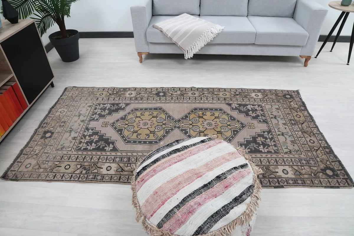 Full view of the rug in a living room setup, complementing the light flooring