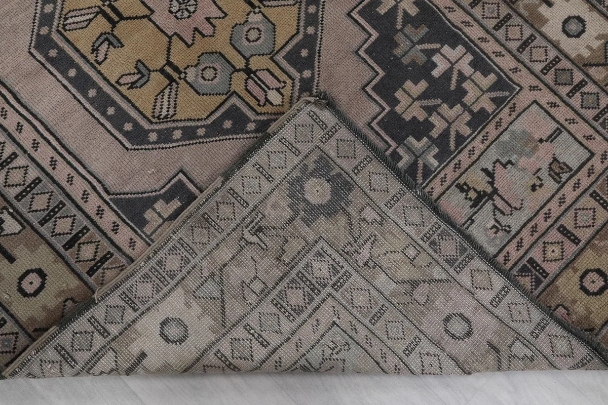 Underside view of the rug, showing the cotton foundation and hand-knotted construction