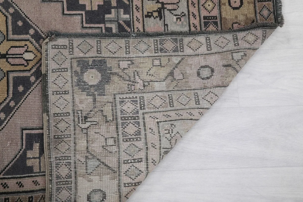 Close-up of the rug's back, revealing the intricate knotting and sturdy foundation