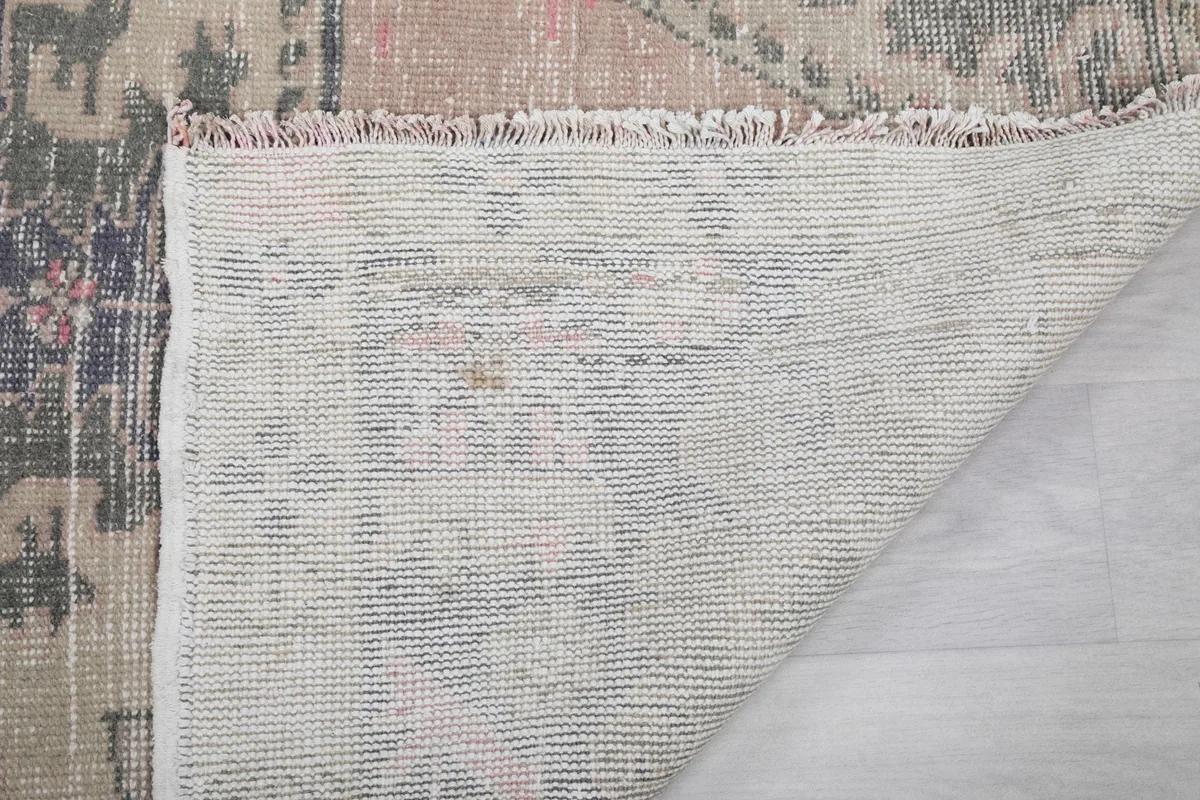 Close-up of the rug's reverse side, revealing the tight knotting and foundation