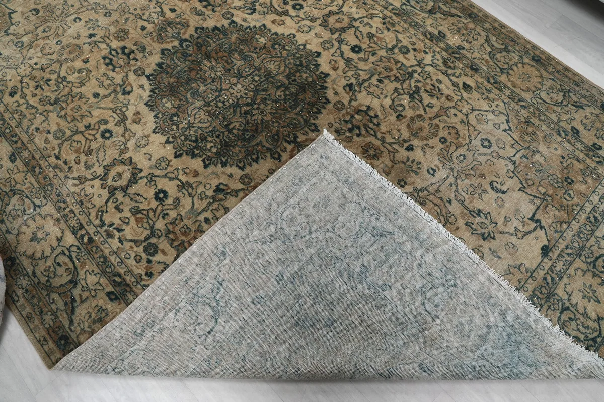 View of the back of the rug, revealing the cotton foundation and hand-knotted construction