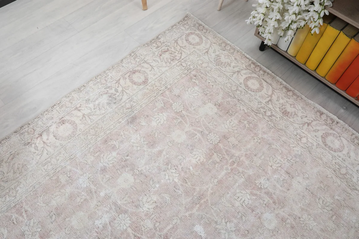Angled shot of the rug's corner, showing the border and main field design