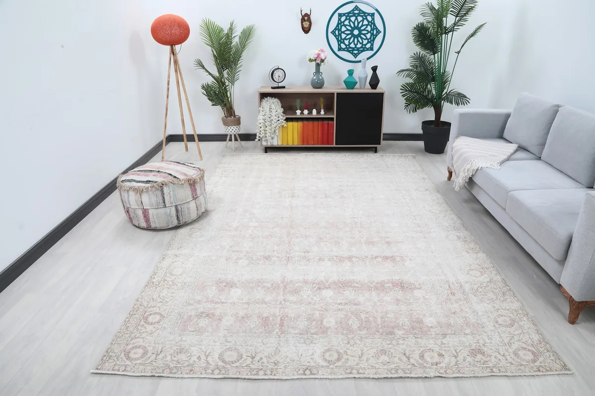 Vintage Anatolian rug in a modern living room setting with a gray couch and wooden furniture