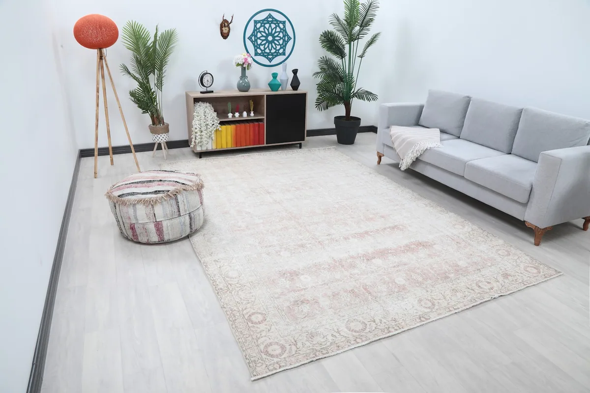 Large area rug in a living space, showcasing its size and colors from an angle