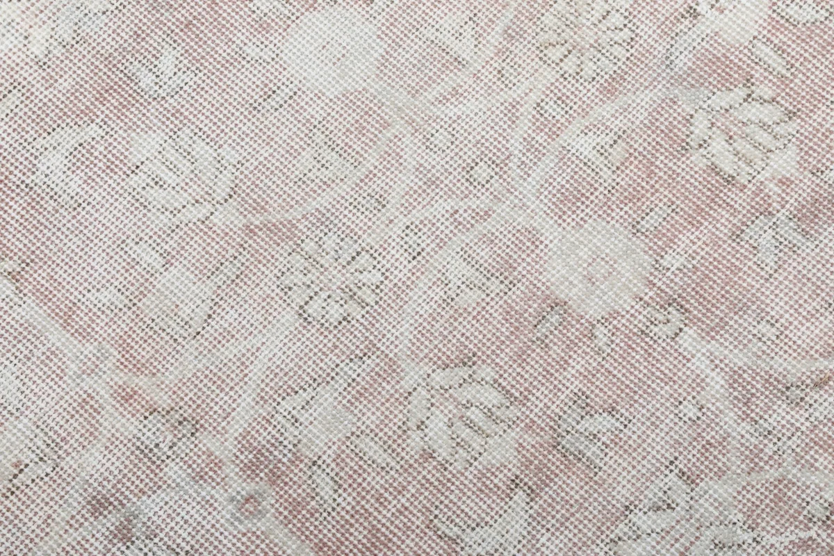 Close-up of the hand-knotted wool pile, showing the texture and subtle color variations