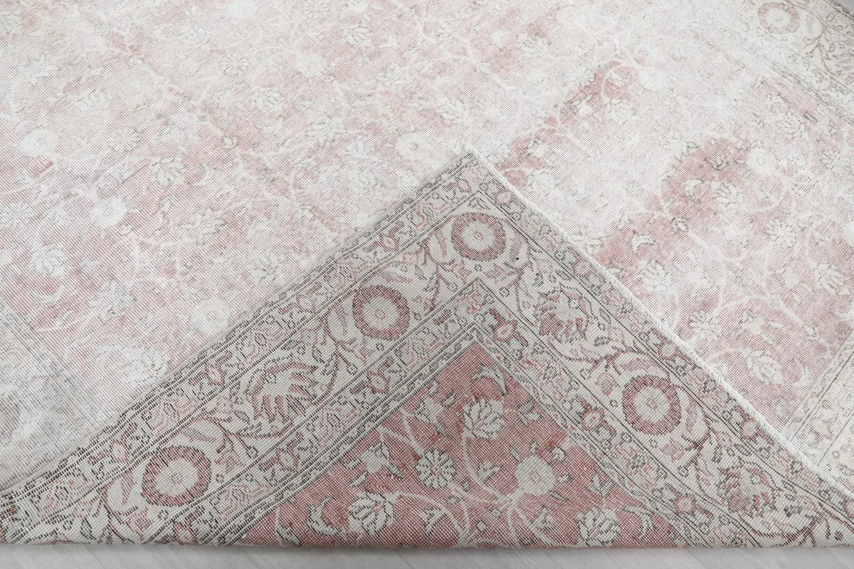 View of the rug's back, revealing the hand-knotted cotton foundation and pile underside