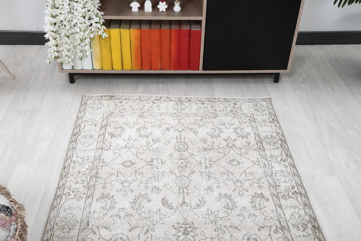 Overhead view of the ivory floral rug showcasing its full pattern and colors