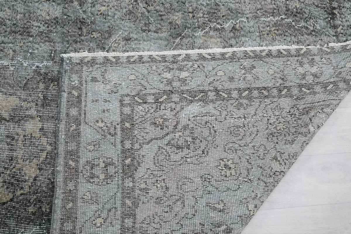 Closer view of the rug's back, showing the hand-knotted construction and cotton foundation