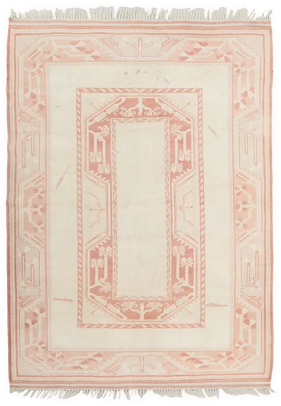 Full top view of the 5'9" x 7'10" ivory and rose vintage Anatolian rug