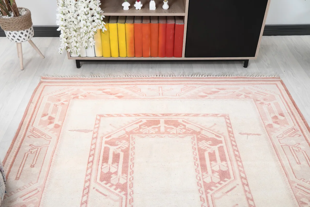 Overhead view focusing on the rug's design and its interaction with the room elements