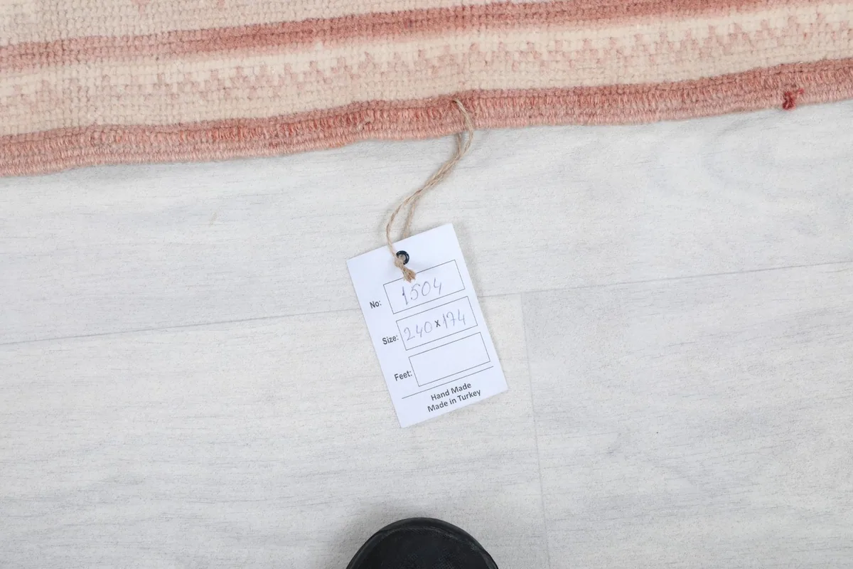 Tag displaying the rug's size and origin, 'Hand Made in Turkey'