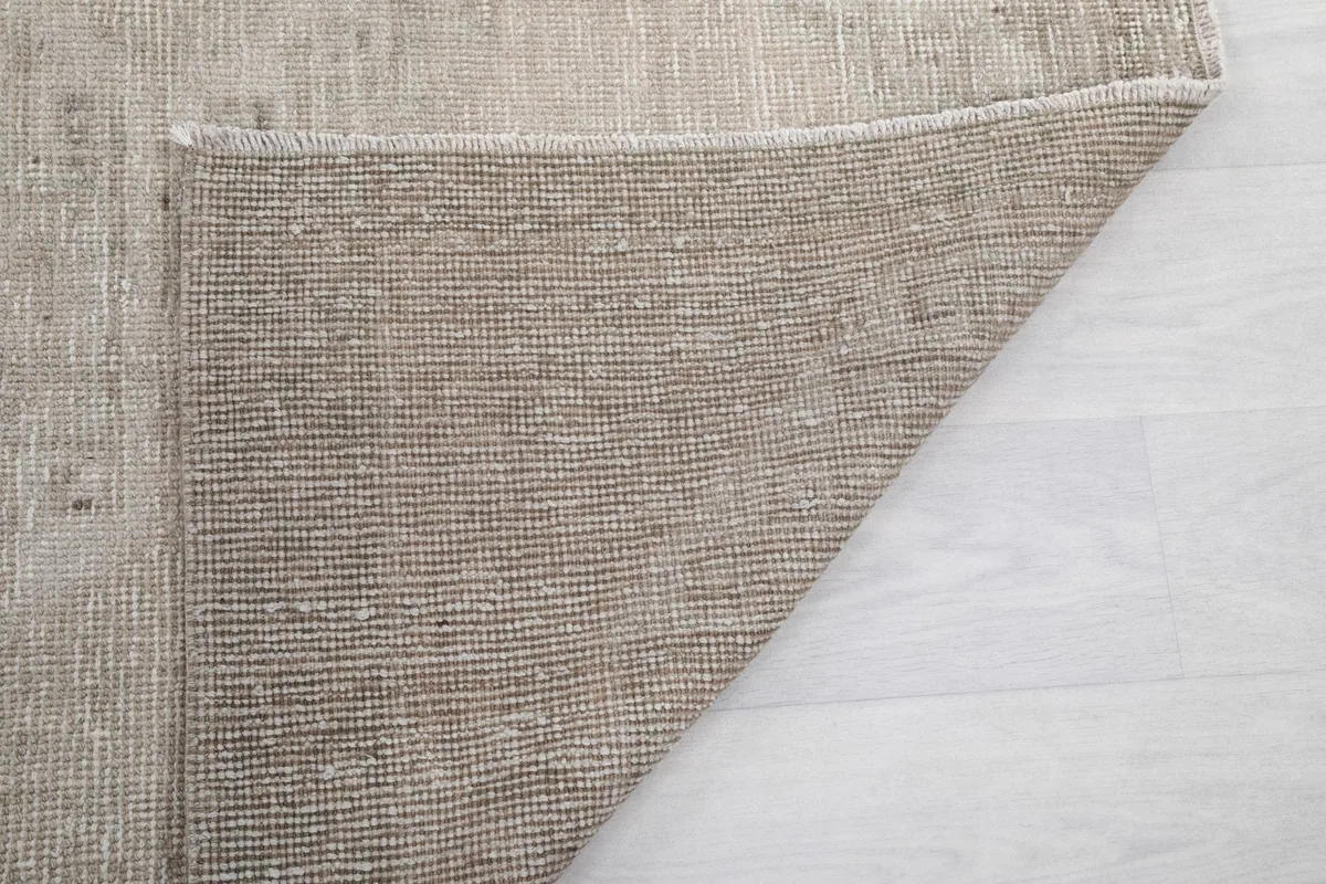 Another view of the rug's back, showing the consistent hand-knotted construction