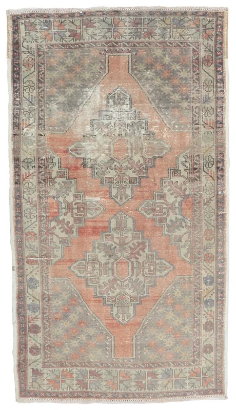 Full overhead view of the 3'10" x 7'0" vintage Anatolian rug with a rust and gray medallion design.
