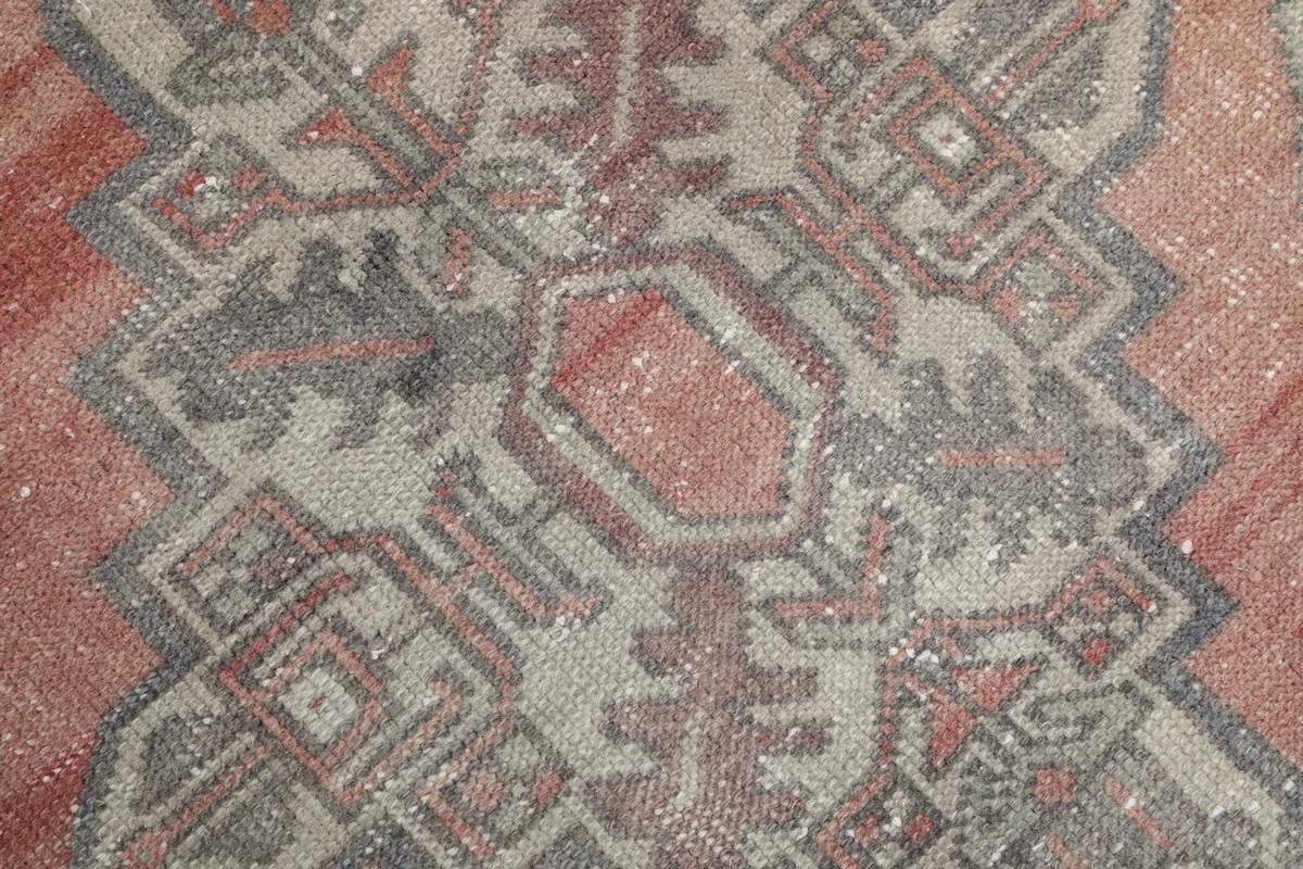 Detailed view of the rug's center, showing the intricate geometric design and texture.
