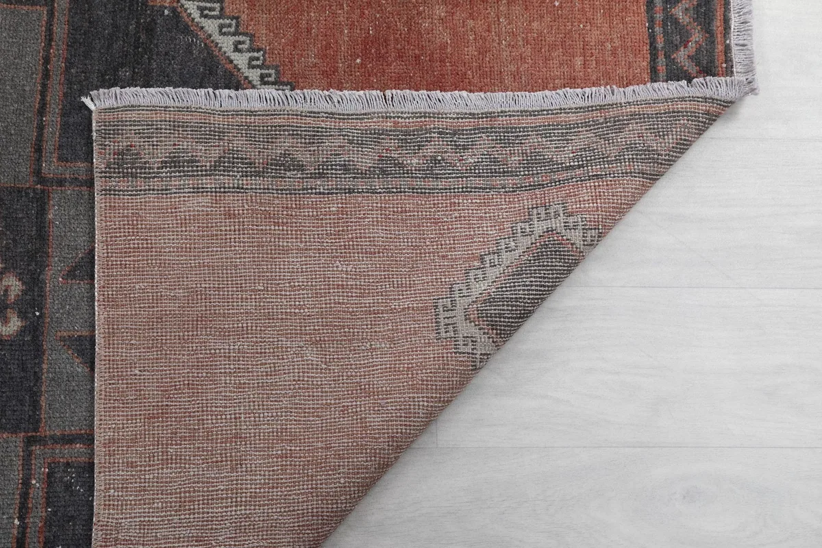 Another view of the back of the rug, showing the reverse side and craftsmanship.