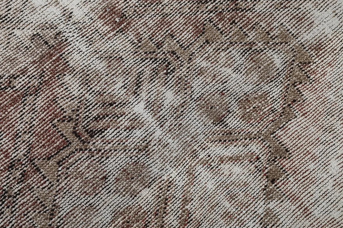 Close-up of the low wool pile and intricate hand-knotted geometric weaving
