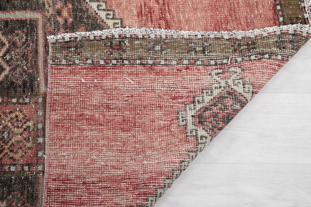 Another close-up of the back of the rug, revealing the tight knotting and material.