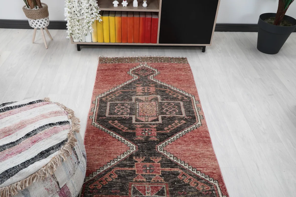 Overhead shot of the runner rug in a room, highlighting the central geometric design.