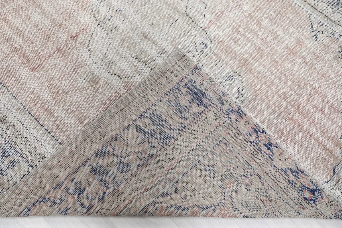 Close-up of a folded corner, revealing the thickness and construction of the rug