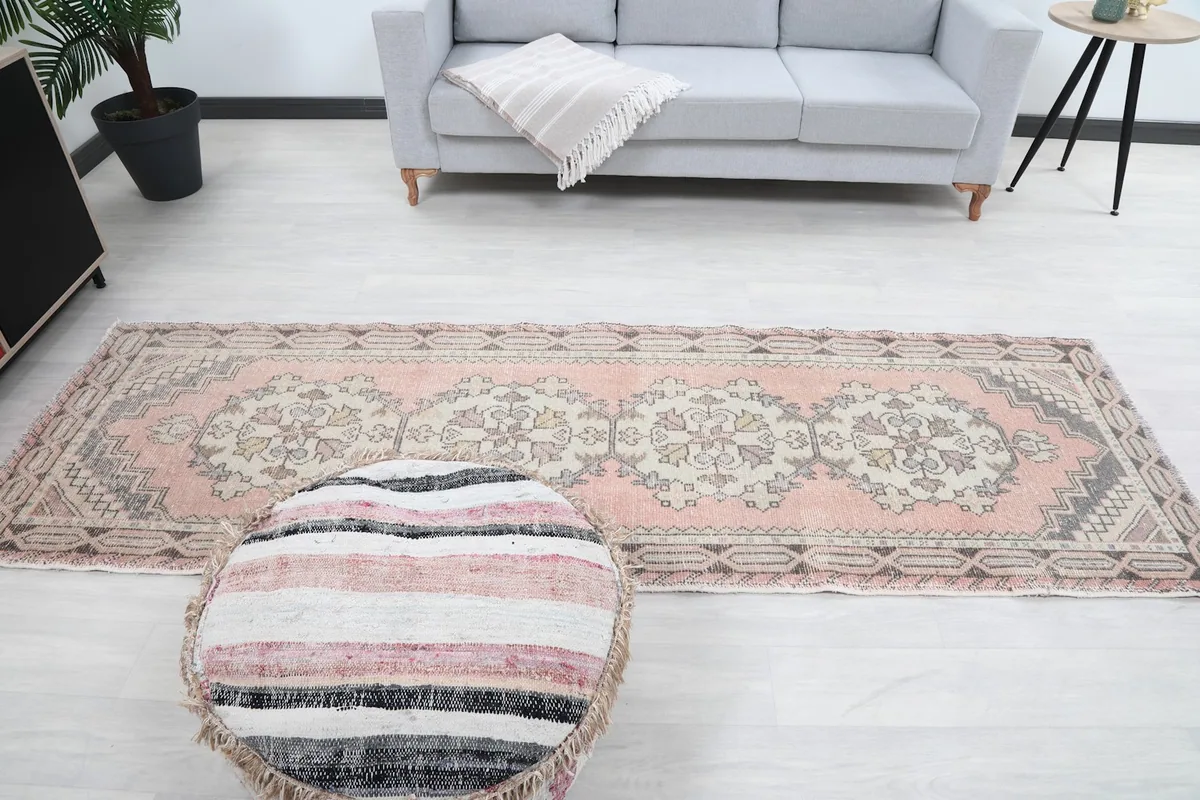 Full length view of the runner rug in a room, from the perspective of the sofa
