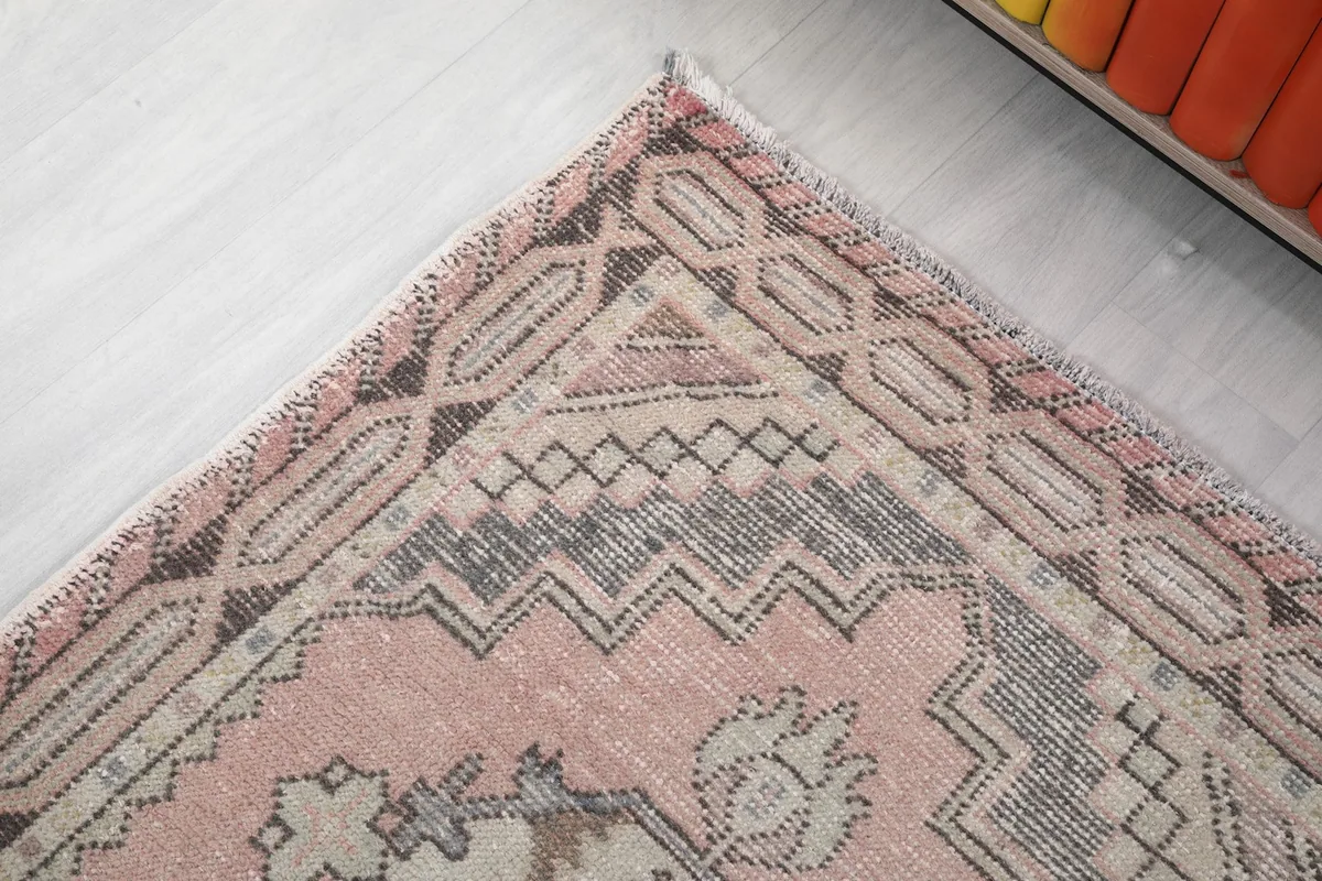 Close-up of the geometric border and corner design, highlighting the intricate patterns