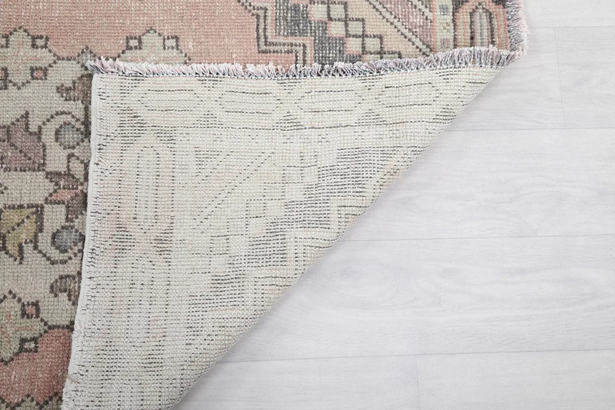 Reverse side of the runner rug, revealing the tightly woven cotton foundation
