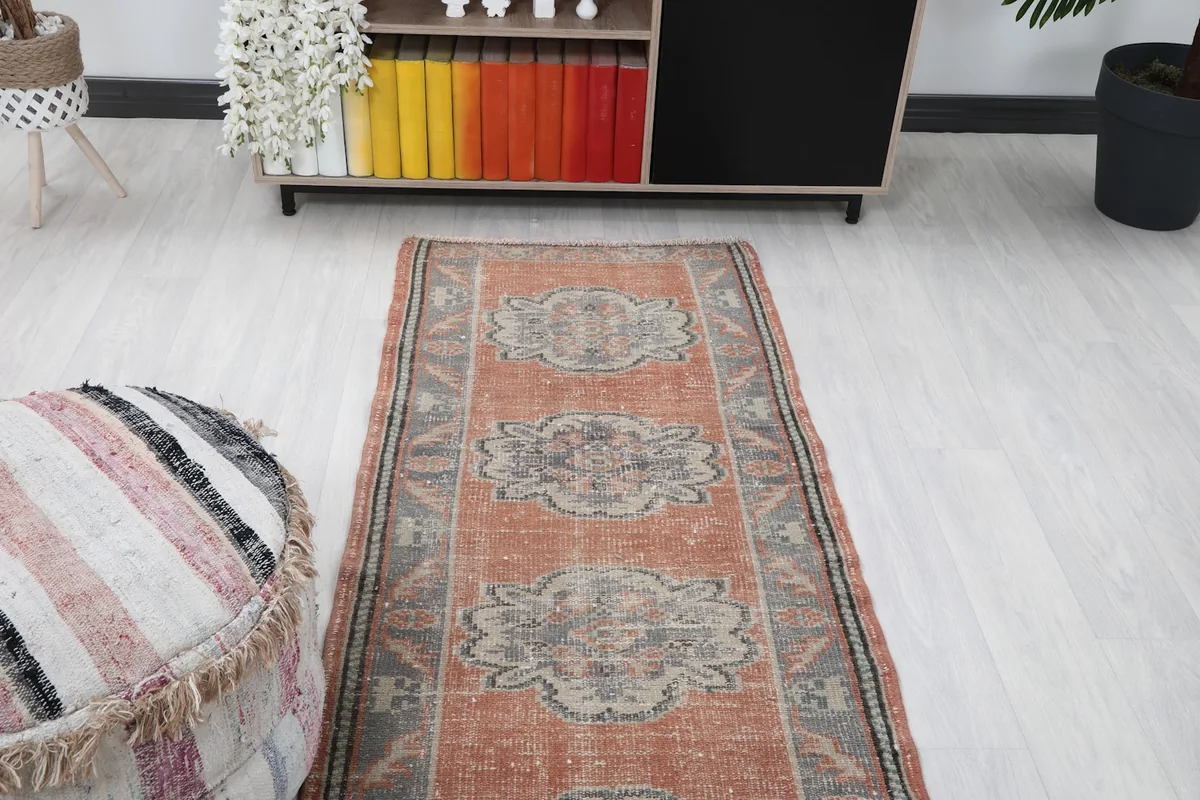 Runner rug from Anatolia in a room, showing its placement in a narrow space.