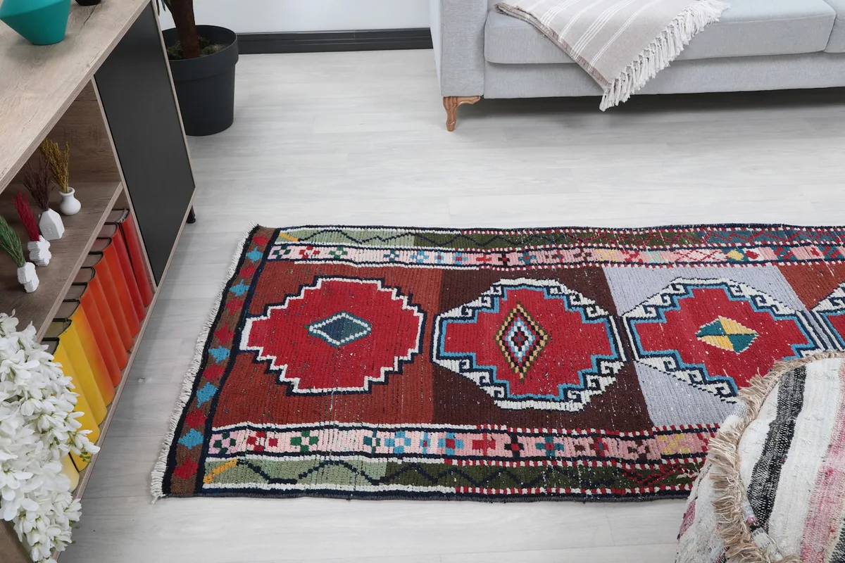 Angled view of the runner rug in a room, emphasizing its length and how it complements the space.