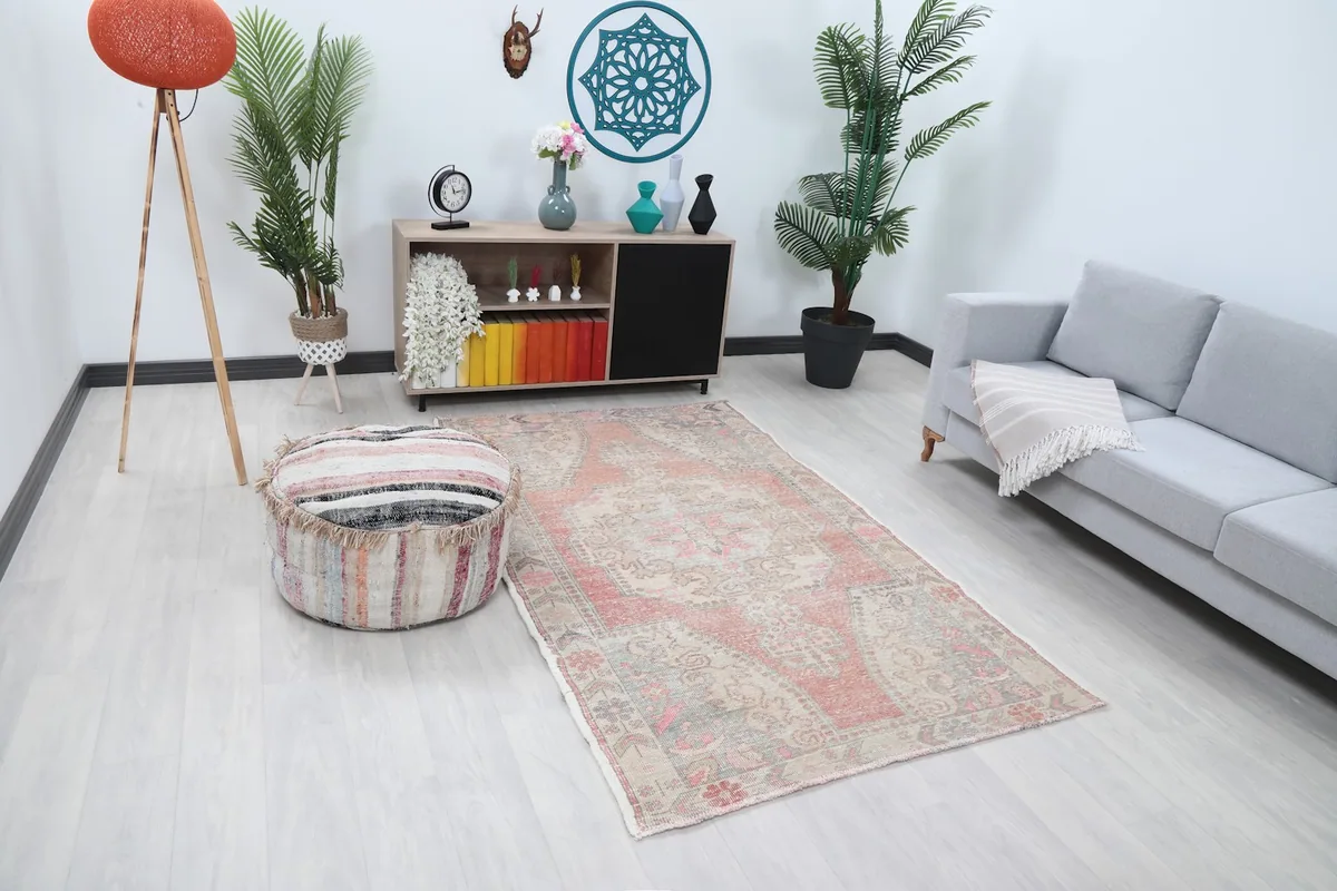 Angled view of the rust beige medallion rug in a modern living space
