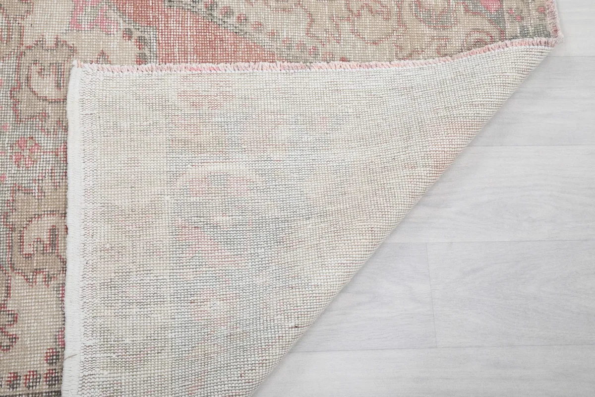 Close-up of the back of the rug, detailing the tight weave and foundation material