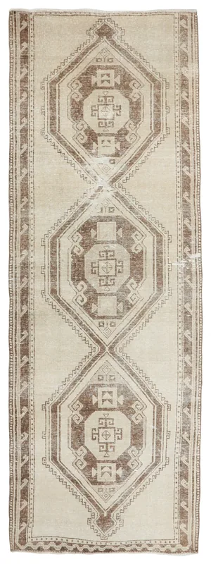 Full overhead view of the 3'8" x 10'11" vintage Anatolian runner rug with cream and brown geometric patterns.