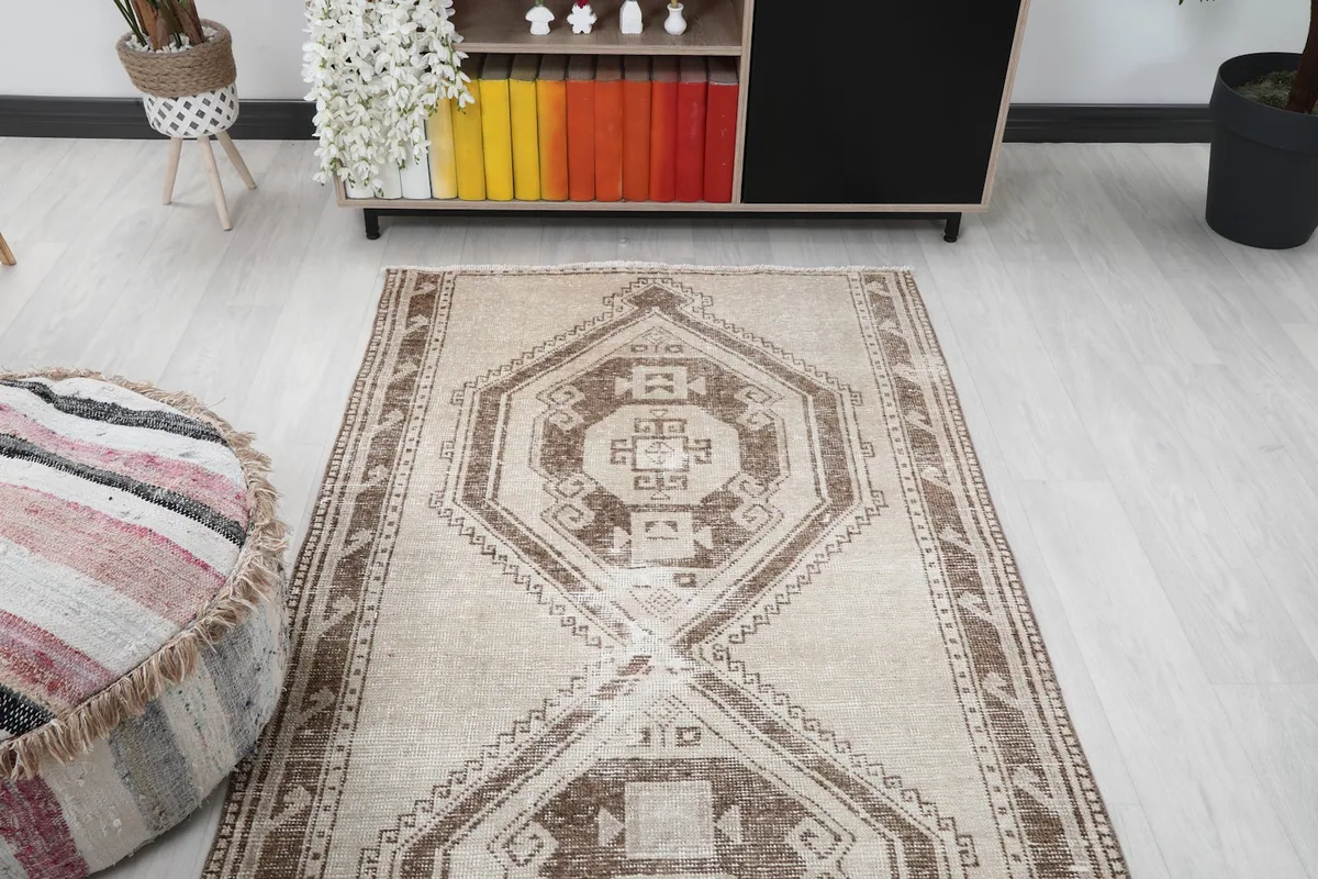 View of the runner rug from one end in the room, emphasizing its length and pattern.