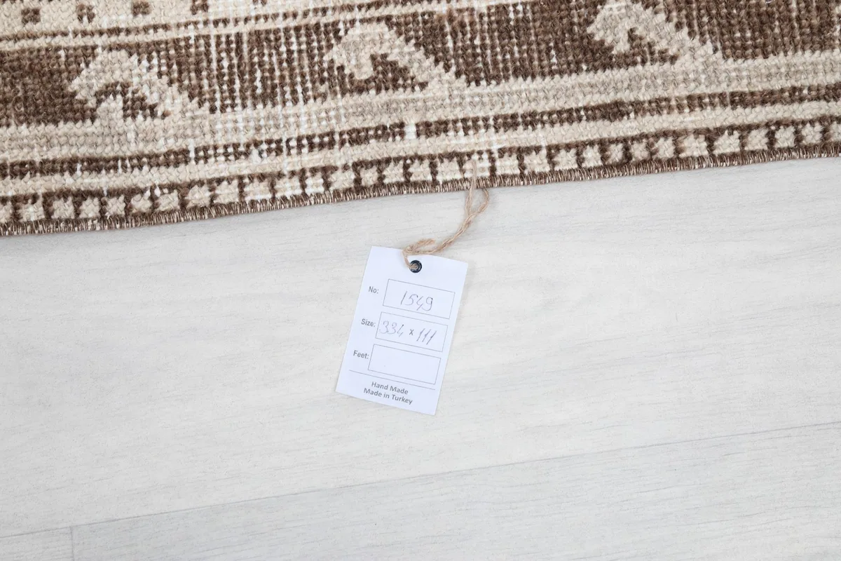 Product tag attached to the rug, displaying size and origin information.