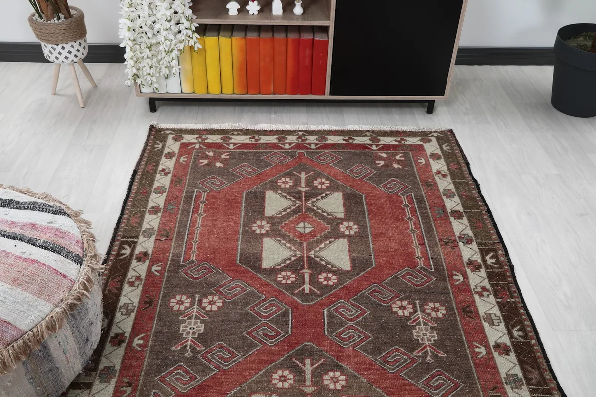 Runner rug viewed from above, showing its placement in a room with a low cabinet and ottoman