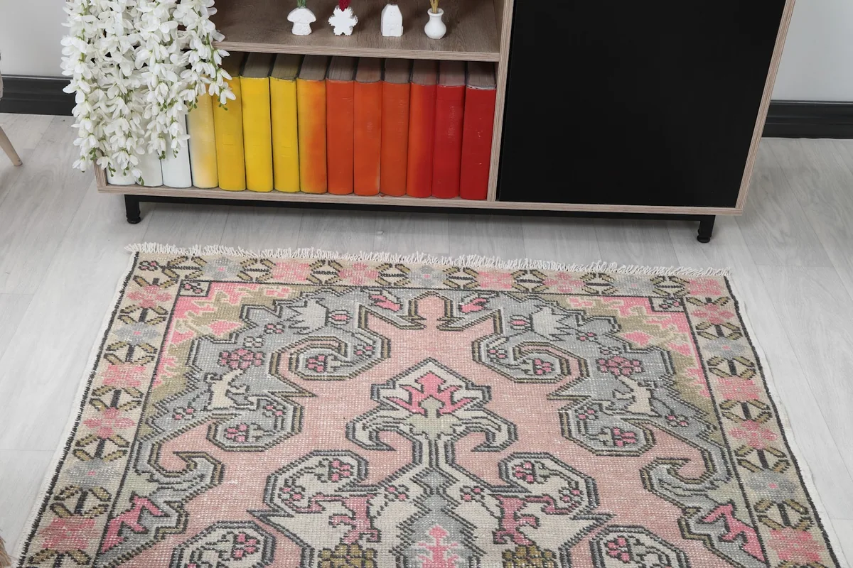 View of the vintage rug from one end, showing its placement in a room.
