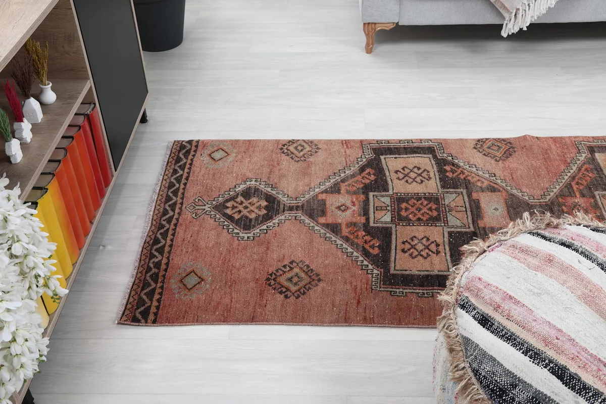 Angle view of the vintage runner rug extending into a modern living space
