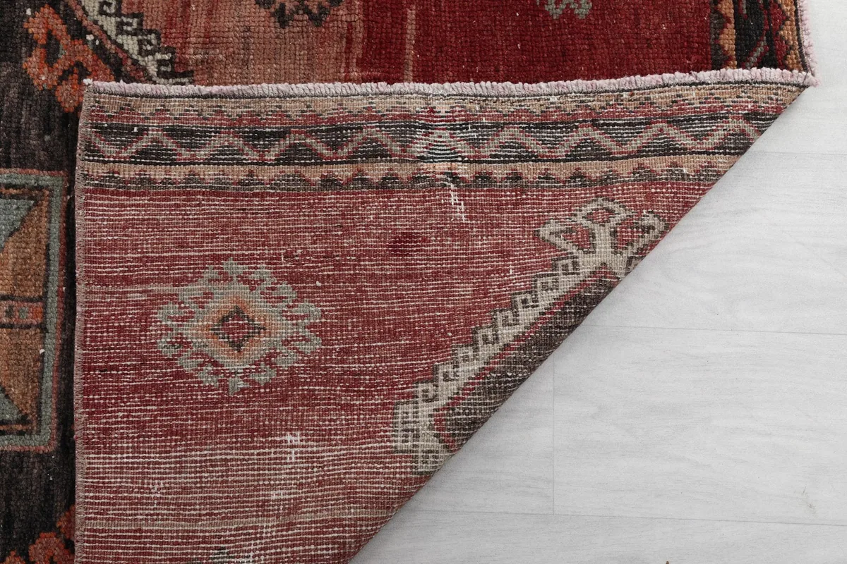 Underside detail of the hand-knotted construction and fringe of the Anatolian runner