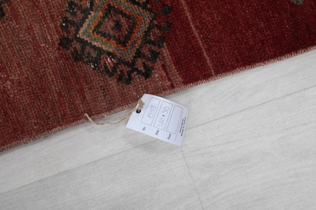 Rug detail showing a product tag with dimensions on the rug's surface
