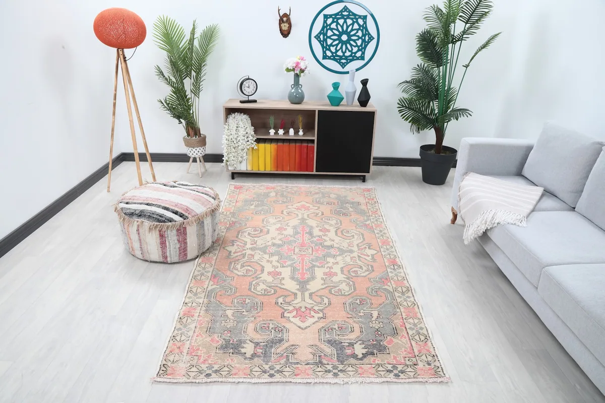 Vintage Anatolian rug displayed in a bright room setting with modern furniture