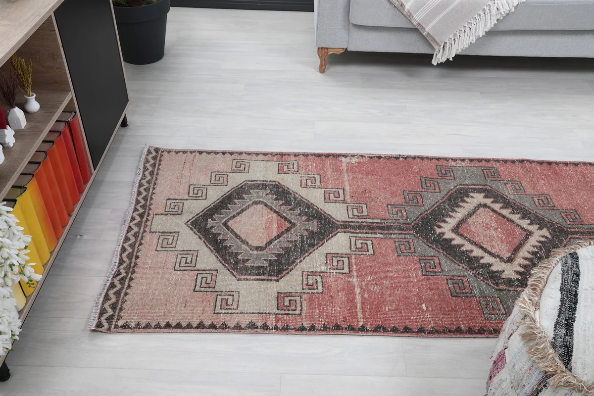 Angled overhead view of the runner rug extending into a modern living space.
