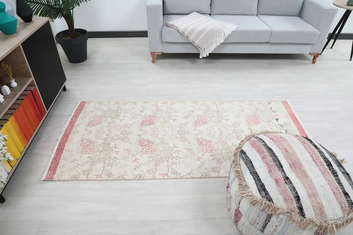 Wide shot of the rug in the room, capturing its overall presence and dimensions.