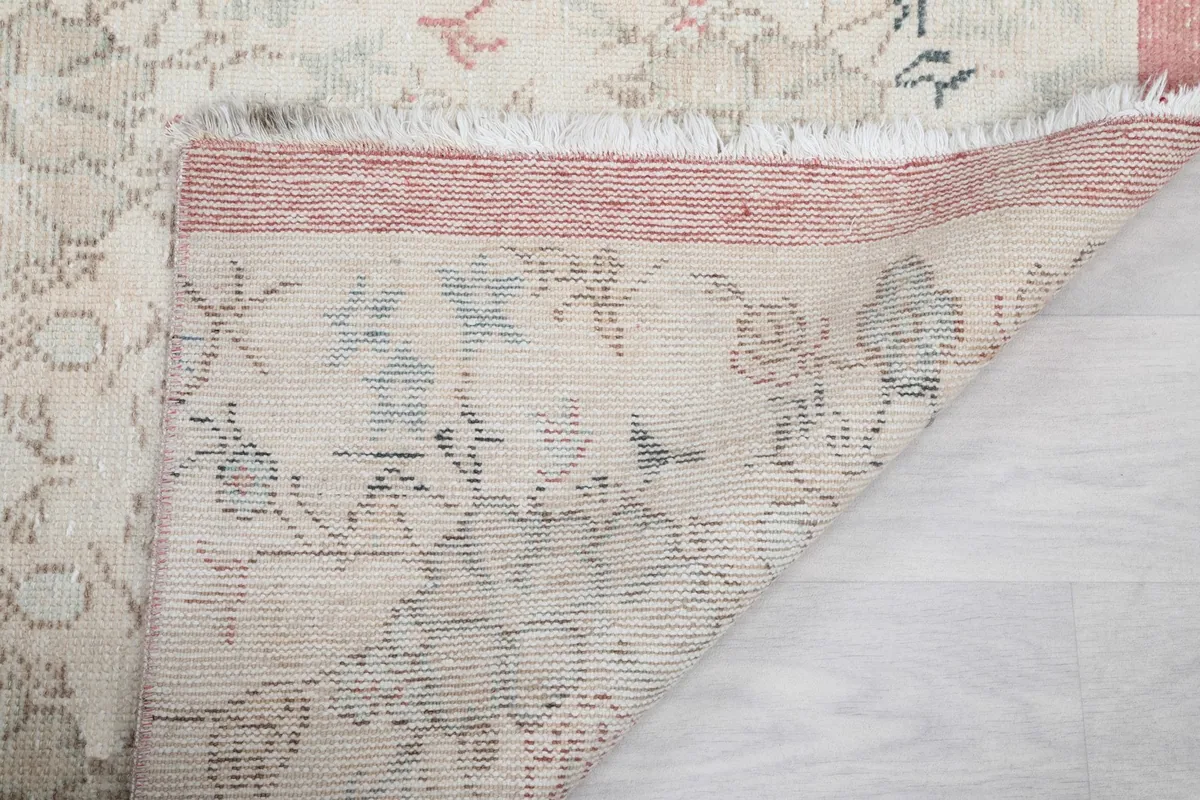 Another view of the back of the rug, detailing the hand-knotted construction.