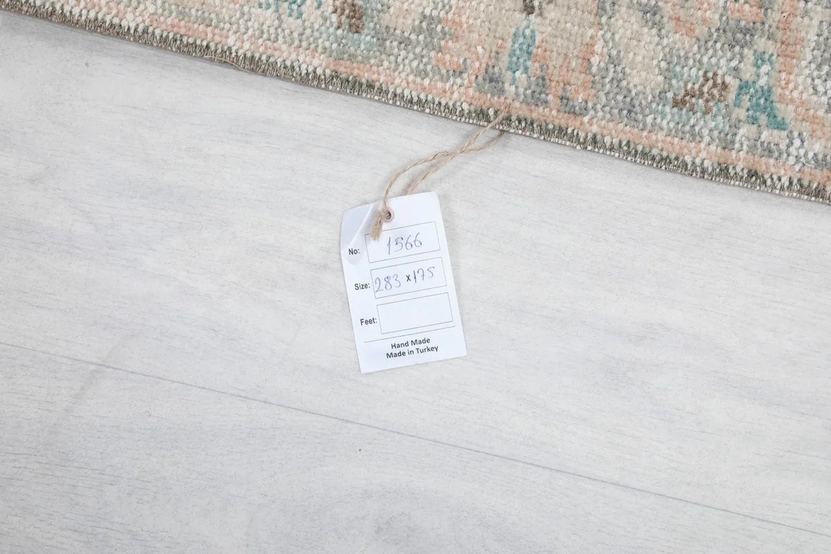 Close-up of the product tag attached to the rug, confirming its origin and size.