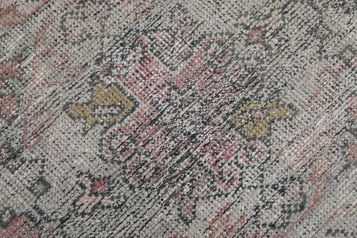 Texture shot showing the low wool pile and intricate hand-knotted weave of the vintage runner