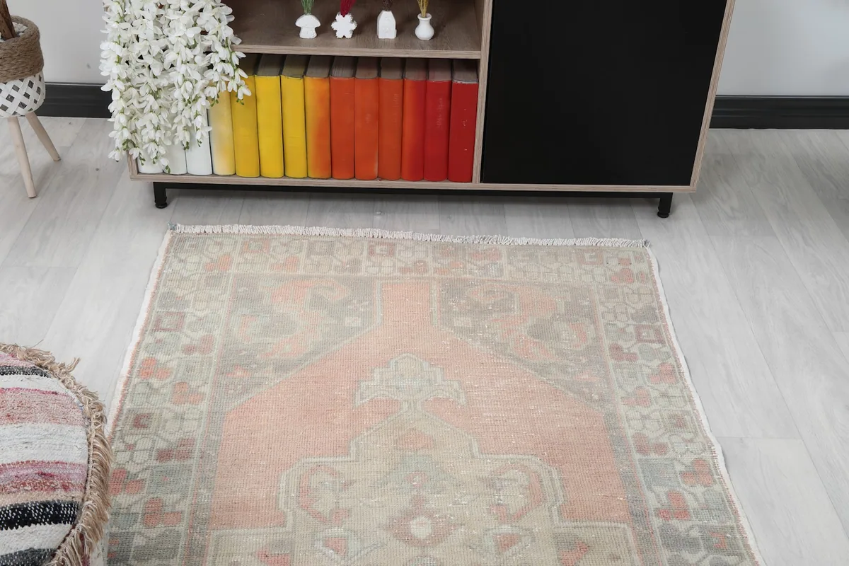 Overhead view of the rug placed in a room, highlighting the overall design and color distribution