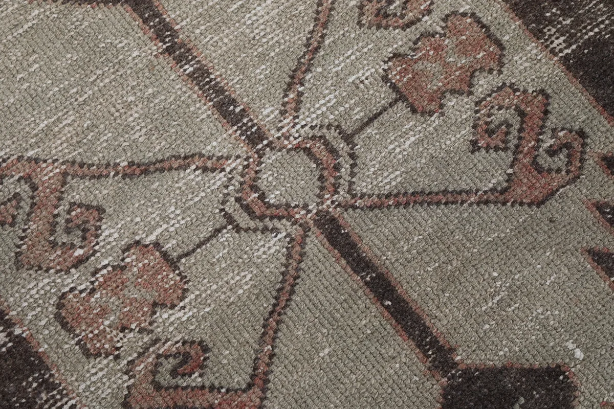 Close-up of the runner's low wool pile, showing the texture and subtle color variations.