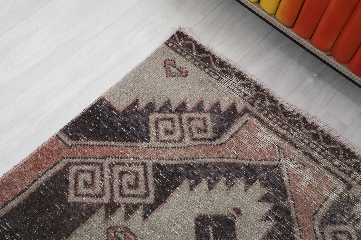 Detailed view of the runner's intricate border design and the geometric elements at its end.