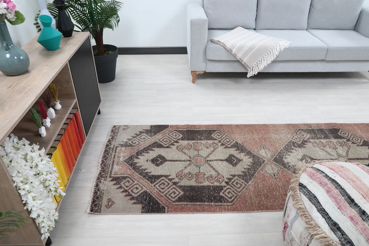 Faded Rust Geometric Anatolian Runner in a room, offering a perspective on its placement and scale.