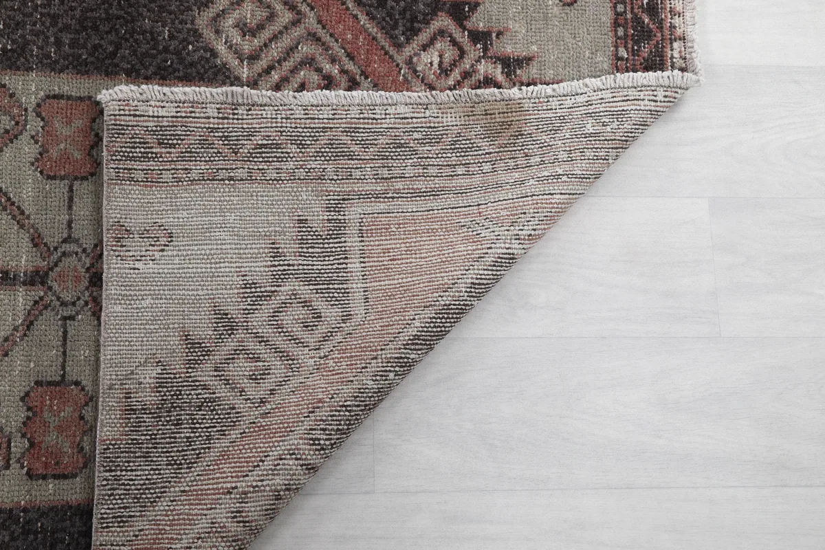 Another view of the runner's back, showcasing the tightly woven structure and foundation material.